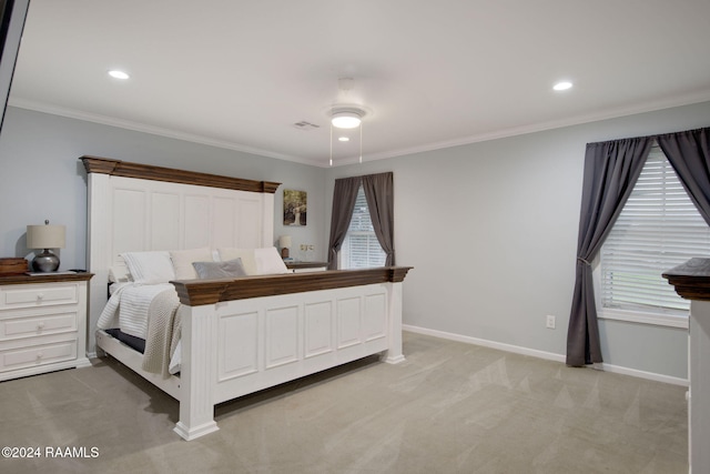 bedroom featuring ceiling fan, crown molding, and light carpet