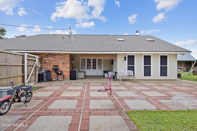 back of house with a patio