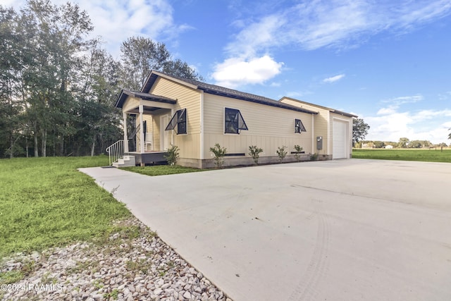 view of property exterior featuring a lawn and a garage