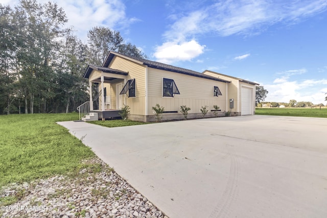 1036 Duhon Rd, Duson, LA 70529 - view of home's exterior with concrete driveway, an attached garage, and a yard