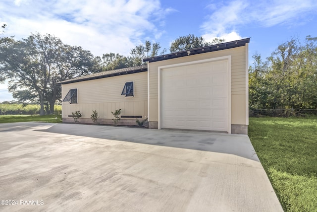 garage with a yard