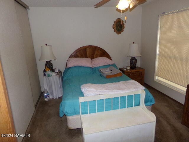 carpeted bedroom featuring ceiling fan