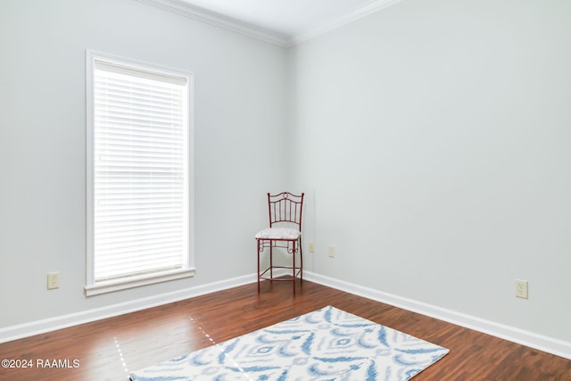 unfurnished room with dark hardwood / wood-style floors and crown molding