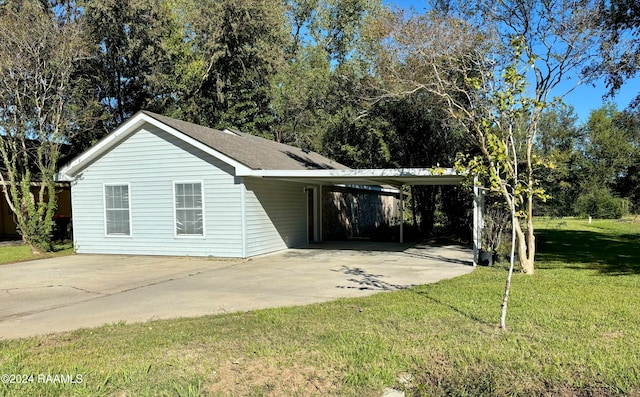 exterior space featuring a front lawn and a carport