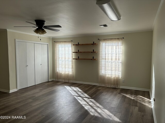 141 Hummingbird Ln, Lafayette, LA 70506 - unfurnished bedroom featuring multiple windows, dark wood-style floors, baseboards, and ornamental molding