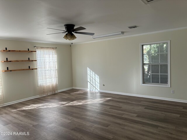 141 Hummingbird Ln, Lafayette, LA 70506 - spare room featuring a ceiling fan, plenty of natural light, crown molding, dark wood-style floors, and baseboards