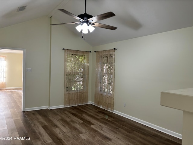 spare room featuring vaulted ceiling with beams, ceiling fan, and dark hardwood / wood-style flooring