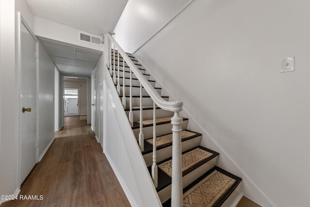 1316 Dulles Dr Apt H, Lafayette, LA 70506 - staircase featuring wood finished floors and baseboards