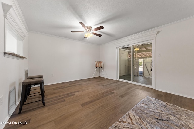 1316 Dulles Dr Apt H, Lafayette, LA 70506 - unfurnished living room with a ceiling fan, wood finished floors, ornamental molding, a textured ceiling, and baseboards
