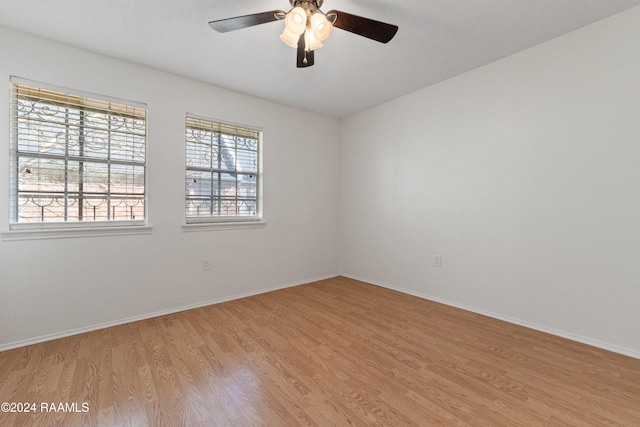 unfurnished room featuring ceiling fan and light hardwood / wood-style floors