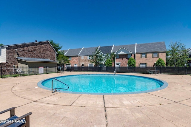 view of pool featuring a patio