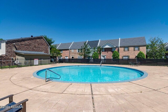 1316 Dulles Dr Apt H, Lafayette, LA 70506 - community pool featuring a patio