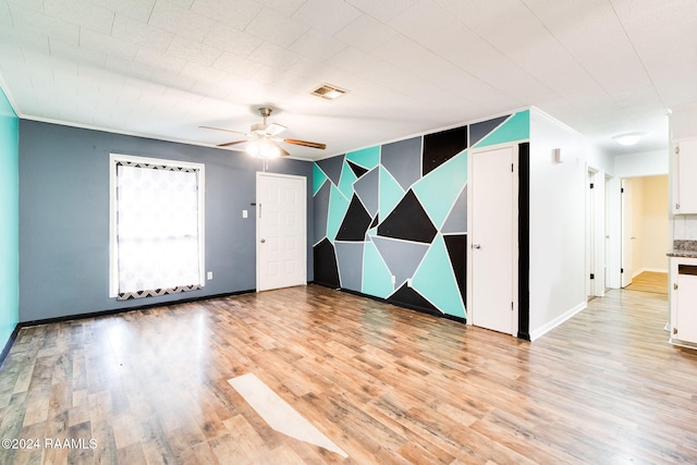 spare room featuring ceiling fan and light hardwood / wood-style floors