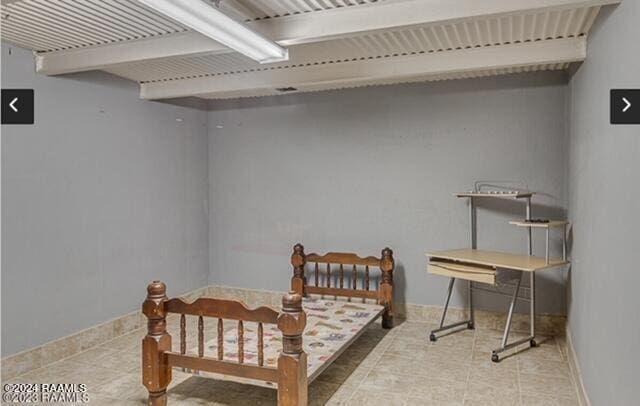 436 E Pont Des Mouton Rd, Lafayette, LA 70507 - bedroom featuring baseboards and tile patterned floors