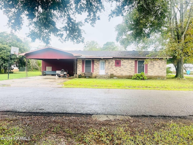 single story home with a carport and a front yard