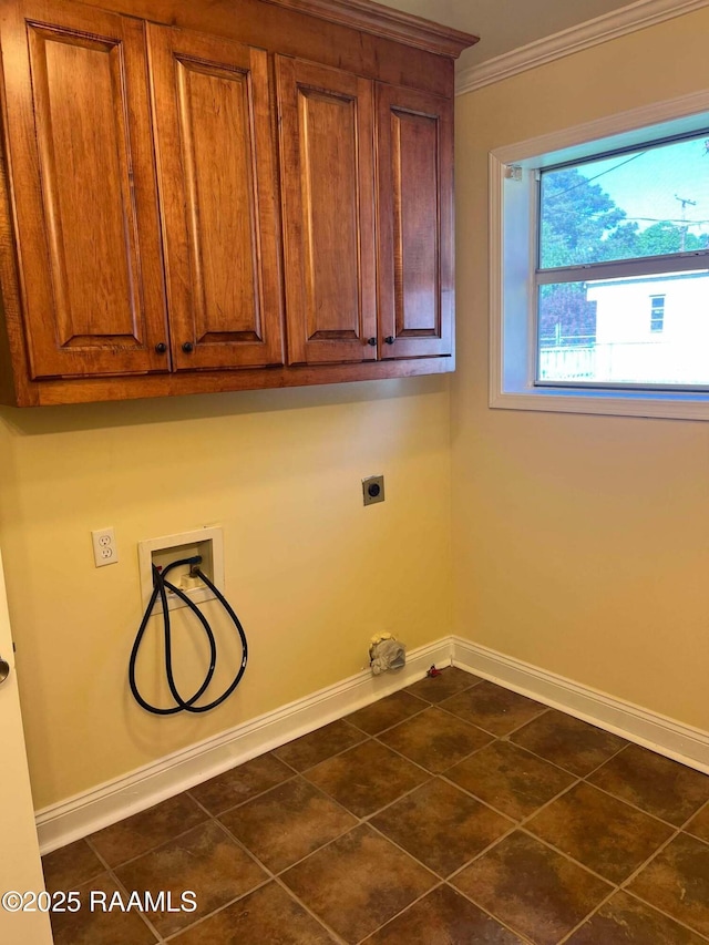 laundry room with hookup for a washing machine, electric dryer hookup, ornamental molding, baseboards, and cabinet space