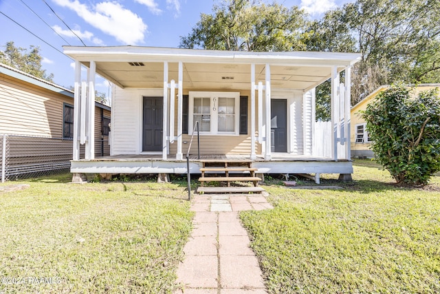 view of front facade with a front yard and a porch