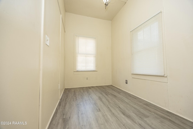 unfurnished room featuring hardwood / wood-style flooring