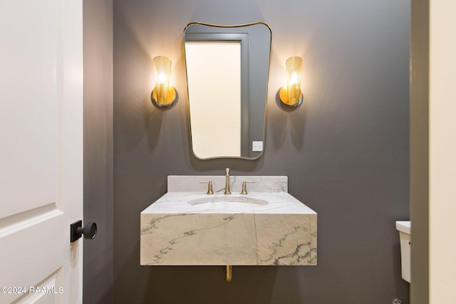 bathroom with toilet and sink