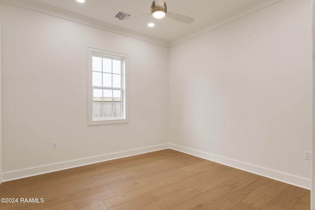 empty room featuring light hardwood / wood-style floors, ceiling fan, and ornamental molding