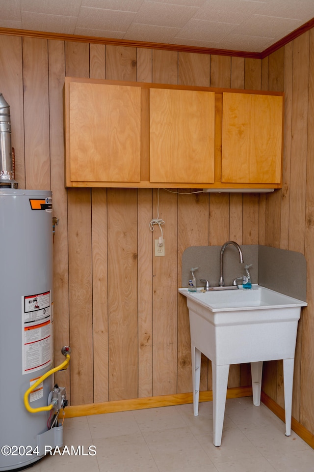 interior space featuring wood walls and gas water heater