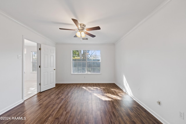 unfurnished room with ceiling fan, dark hardwood / wood-style flooring, and ornamental molding