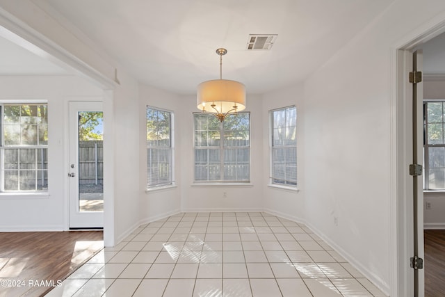 unfurnished sunroom with a healthy amount of sunlight