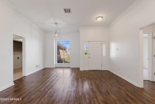 foyer entrance featuring dark hardwood / wood-style floors and ornamental molding