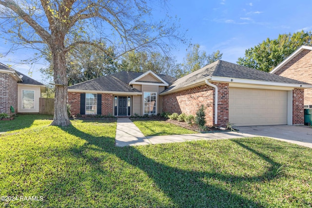 single story home featuring a front yard and a garage