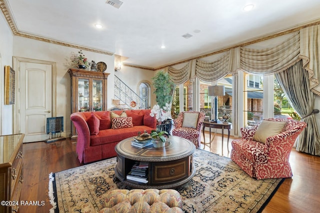 living room featuring crown molding and dark hardwood / wood-style floors