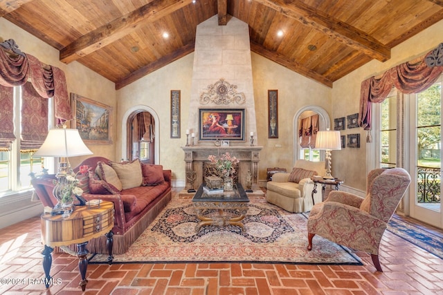 107 Western Ln, Lafayette, LA 70507 - living area featuring wood ceiling with exposed beams, plenty of natural light, brick flooring, arched walkways, and high vaulted ceiling