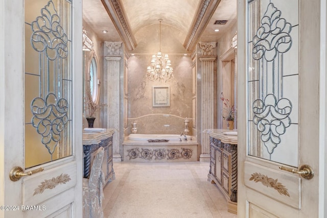107 Western Ln, Lafayette, LA 70507 - bathroom with vanity, a chandelier, lofted ceiling, a garden tub, and tile patterned flooring