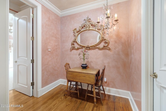 107 Western Ln, Lafayette, LA 70507 - dining space featuring wood finished floors, a chandelier, crown molding, and baseboards