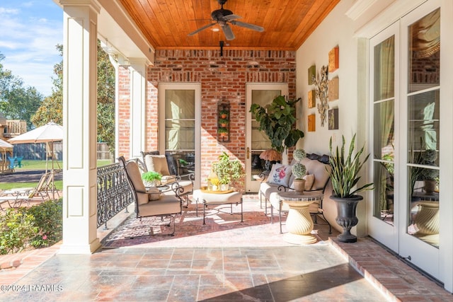 view of patio featuring ceiling fan