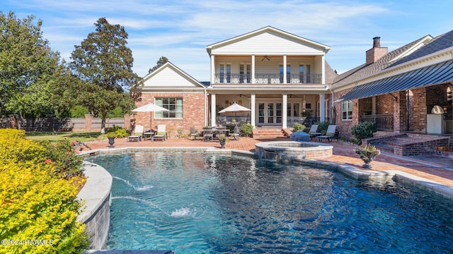 107 Western Ln, Lafayette, LA 70507 - back of house with french doors, a ceiling fan, a patio, a balcony, and brick siding