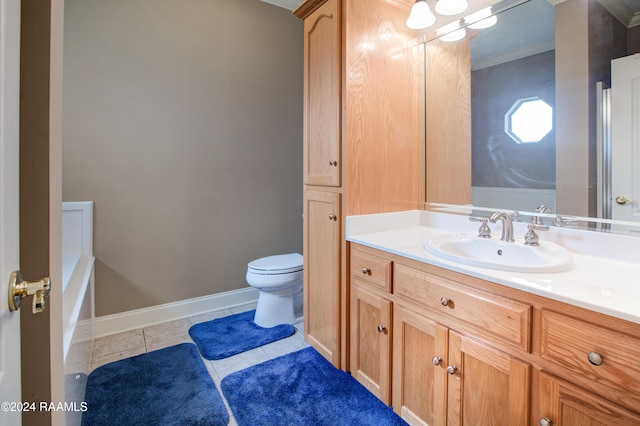 bathroom with tile patterned floors, vanity, and toilet