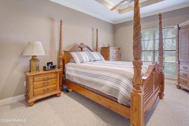 carpeted bedroom with ceiling fan and ornamental molding