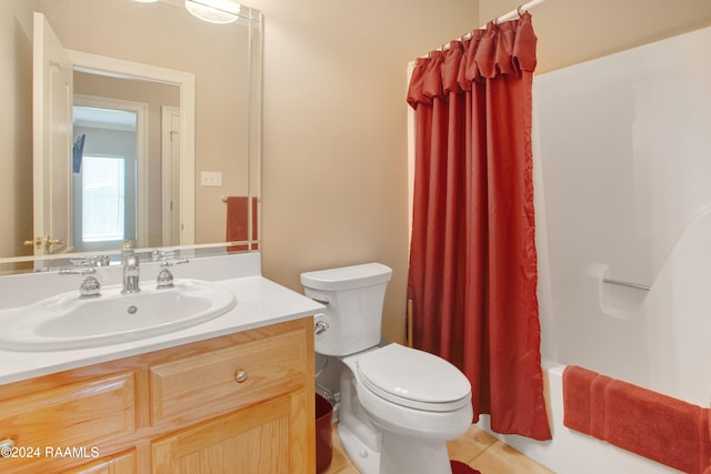 full bathroom with tile patterned flooring, vanity, toilet, and shower / bath combo with shower curtain