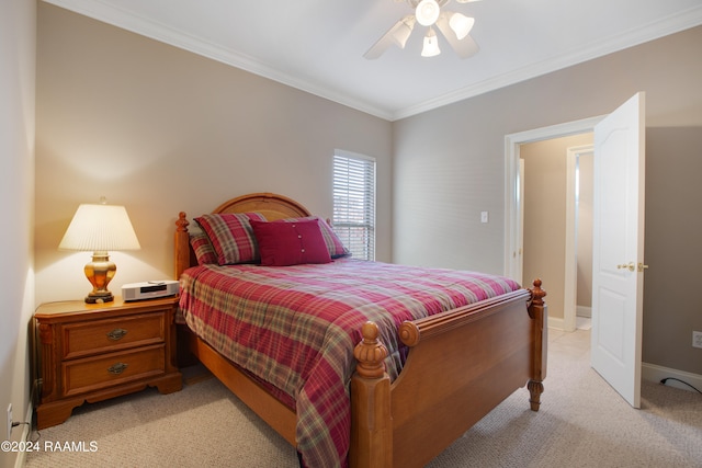 bedroom with light carpet, ceiling fan, and crown molding