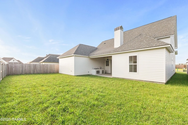 407 Sunshine Rise Dr, Broussard, LA 70518 - rear view of property featuring a fenced backyard, a patio area, a chimney, and roof with shingles