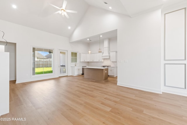 407 Sunshine Rise Dr, Broussard, LA 70518 - unfurnished living room featuring ceiling fan, high vaulted ceiling, light wood-style flooring, and recessed lighting