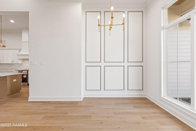 407 Sunshine Rise Dr, Broussard, LA 70518 - unfurnished dining area with a chandelier, crown molding, light wood-style floors, and recessed lighting
