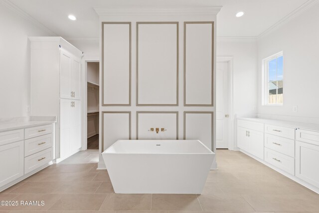 407 Sunshine Rise Dr, Broussard, LA 70518 - bathroom featuring a freestanding bath, ornamental molding, recessed lighting, tile patterned floors, and a spacious closet