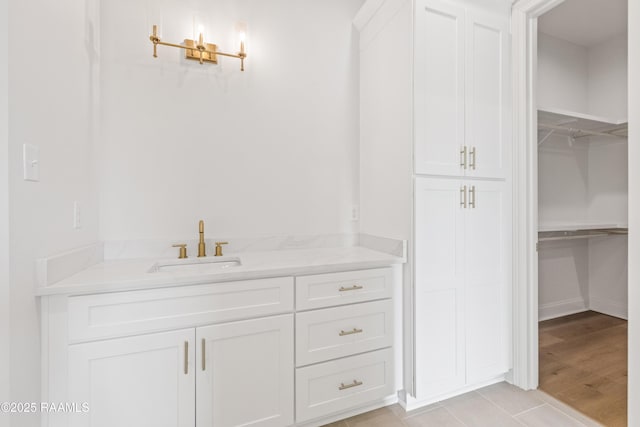 407 Sunshine Rise Dr, Broussard, LA 70518 - bathroom with vanity, a walk in closet, and tile patterned floors