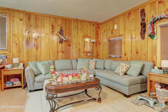 living room with wooden walls and light tile patterned flooring