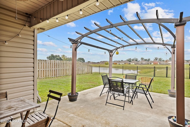 view of patio featuring a water view and a pergola