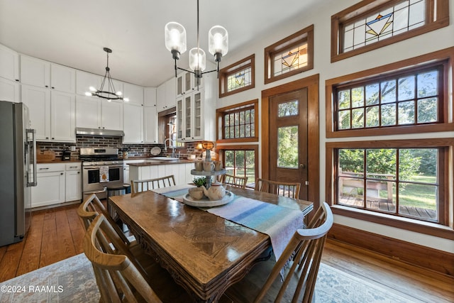 193A Notre Reve Ln, Arnaudville, LA 70512 - dining room featuring a chandelier, dark wood finished floors, and a high ceiling