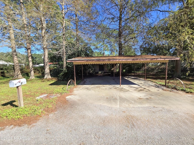 view of parking / parking lot featuring a carport