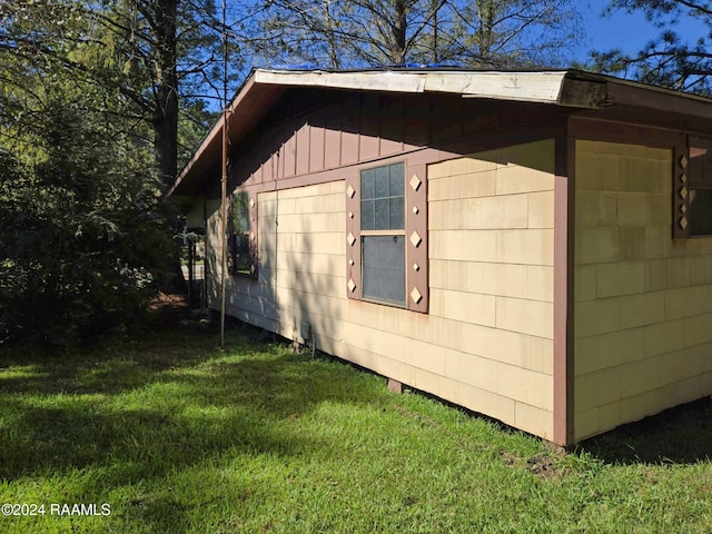 view of home's exterior with a yard