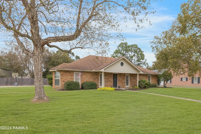 ranch-style home featuring a front yard